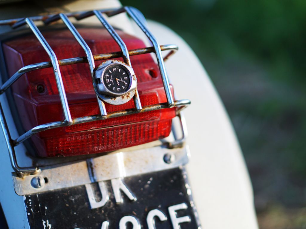 May Holidays' with antique motorcycles and Scala Hotel.
